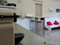 Photos of the common areas of Cal Sabater d'Ordis, dining room, kitchen, entrance hall, games room